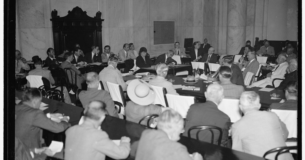 A packed legislative committee hearing room