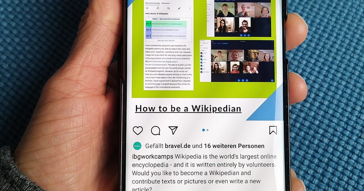 A hand holding a smartphone