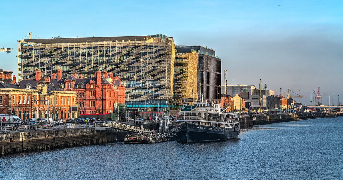 A central bank headquarters building on a waterfront
